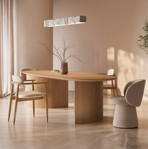 Elvora Natural Wood Oval Dining Table – in a dining room