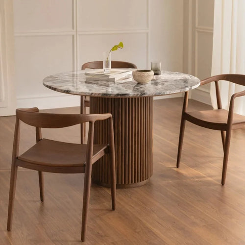 Vittoro Marble Round Dining Table – in a dining room
