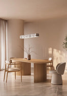 Switch Top-down view of modern dining table with soft-edge oval shape and smooth wood finish 3 image