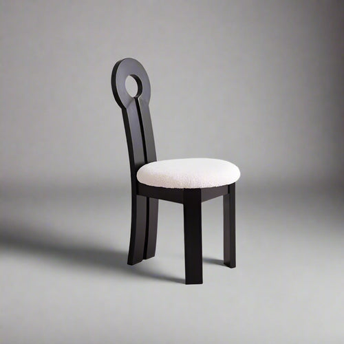 Noor White Boucle Wooden Dining Chair in Black – angled view