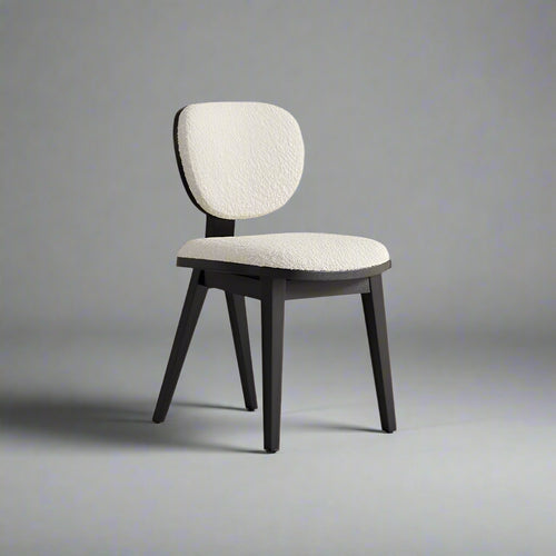 Selva Cream Boucle Dining Chair in Black – angled view