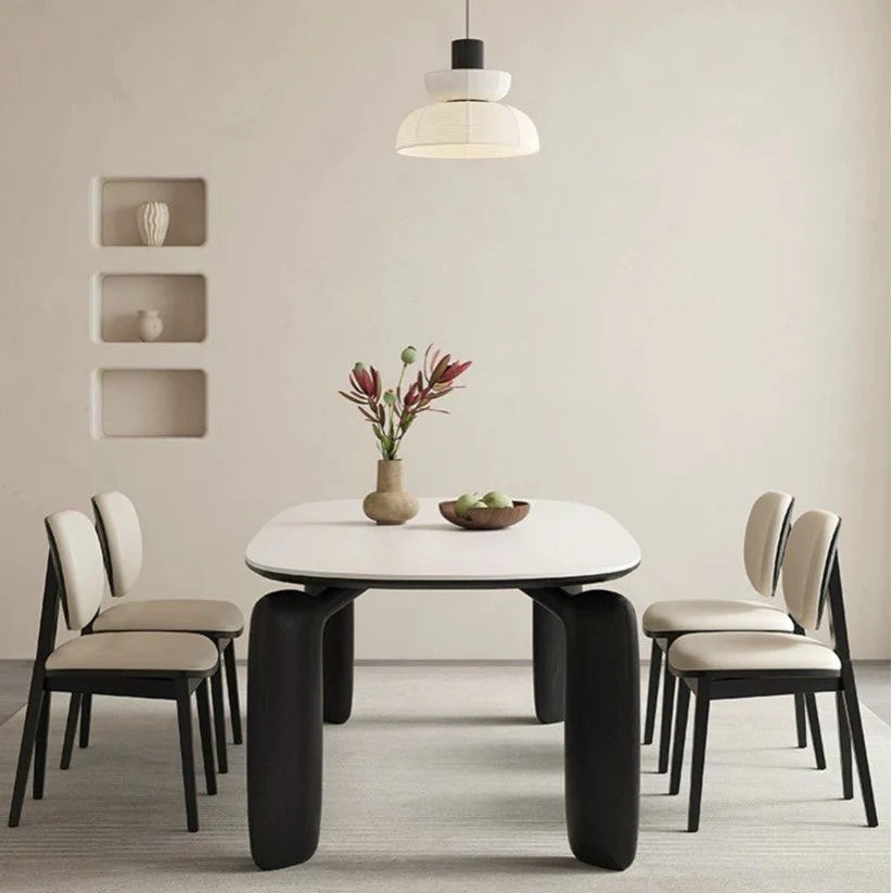 Black Selva chair placed beside a dining table