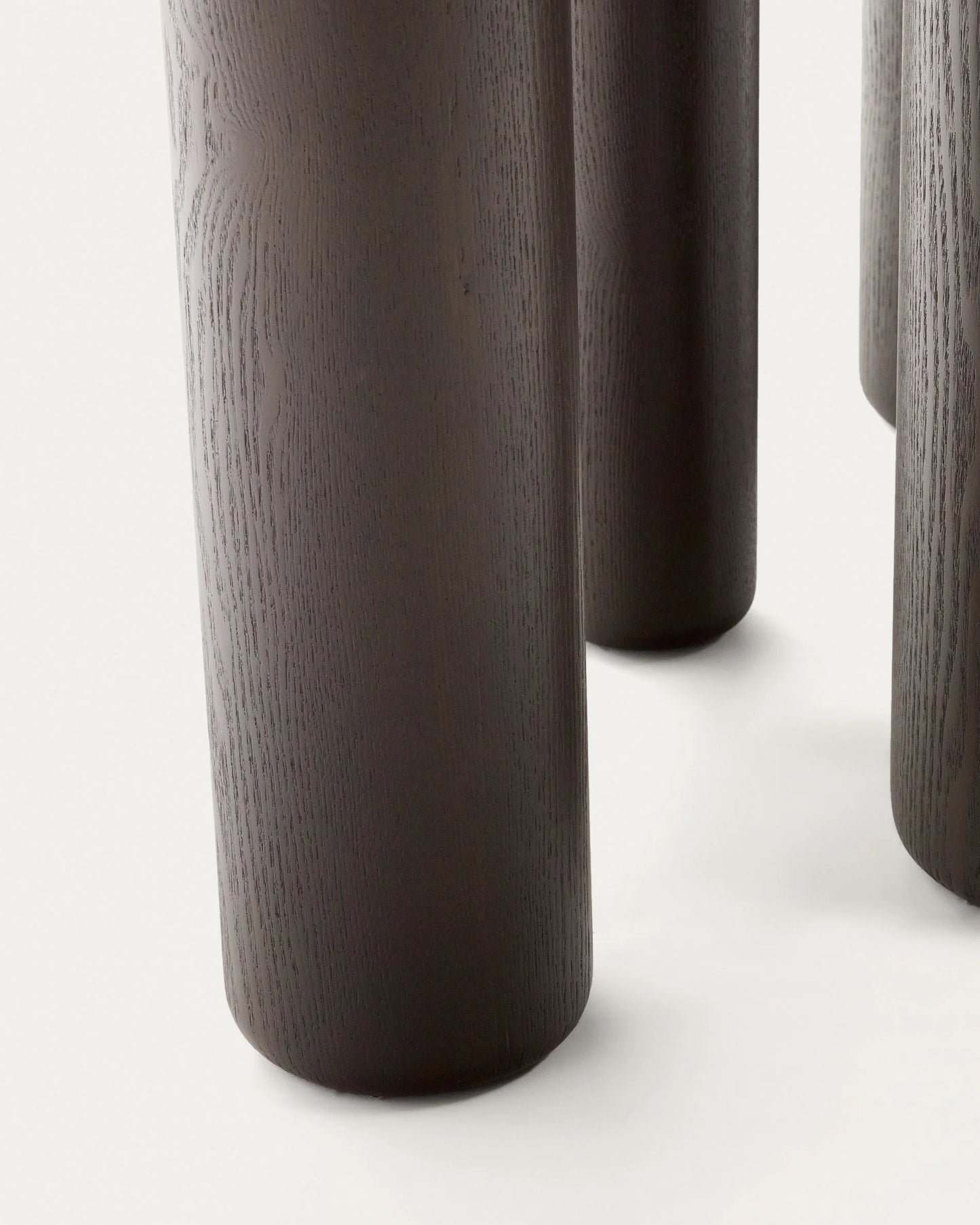 Close-Up of Sora Dining Table – Unique Leg Design – Tapered Legs Dark Finish – Organic Modern Style