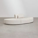 Switch Side angled view of Vellura sofa set showing modular ottomans and curved backrest design 2 image
