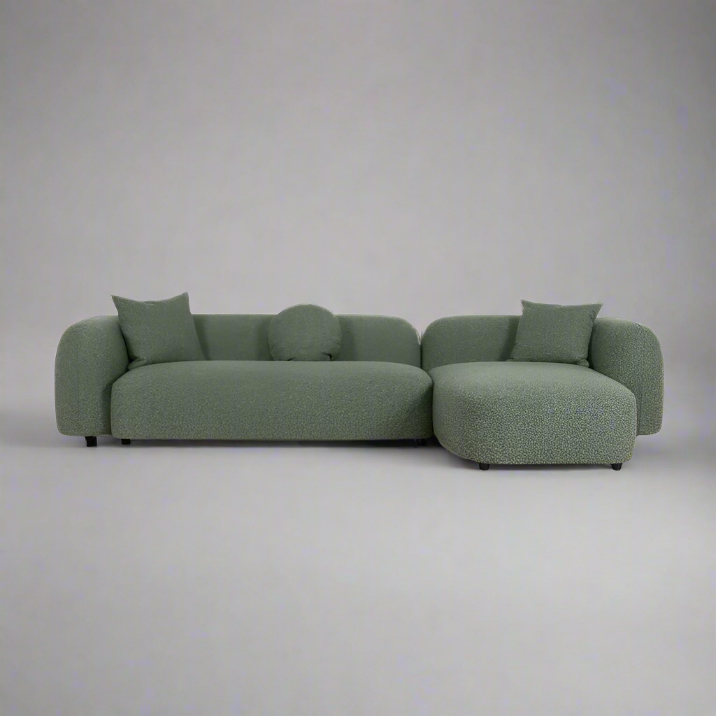 Front angle view of Verona Right-Chaise Sofa in Amazon Green with curved design and plush seating