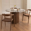 Switch Vittoro round table styled in modern interior with stone top and cylindrical wooden base 2 image