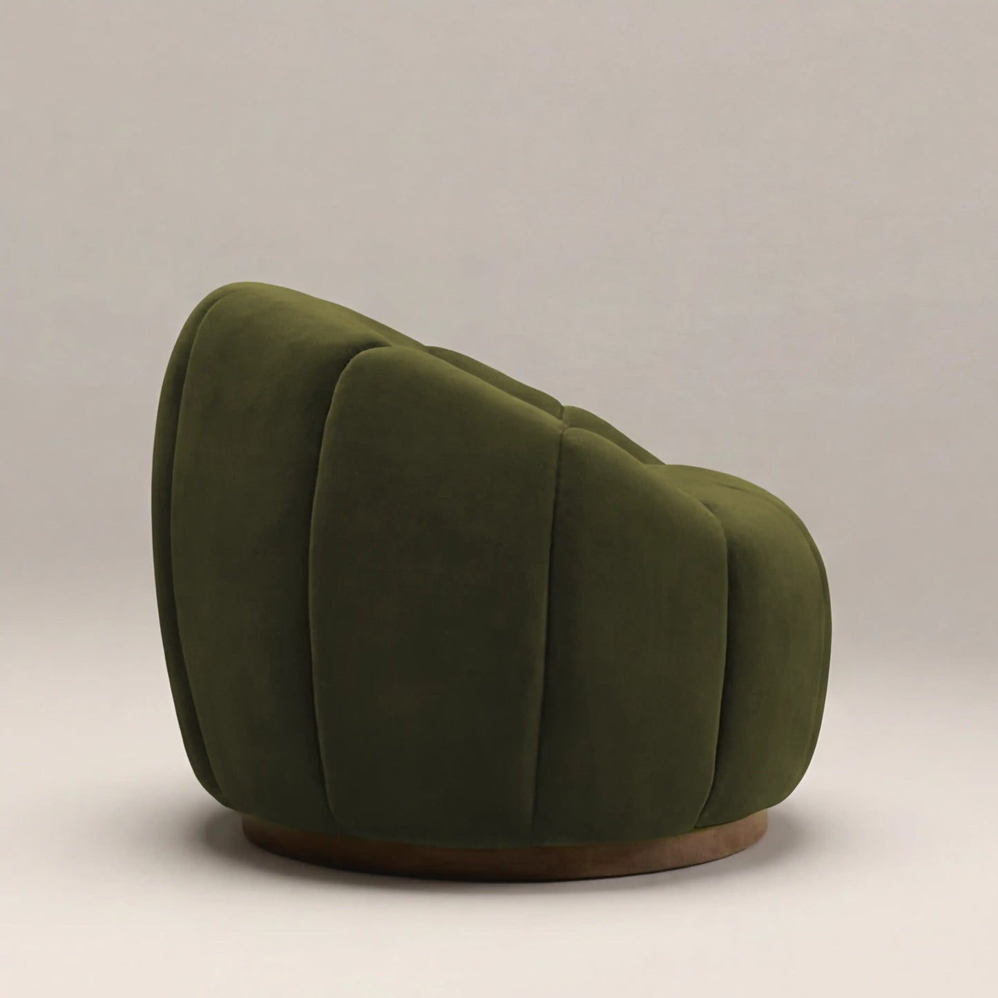 Green swivel armchair side profile