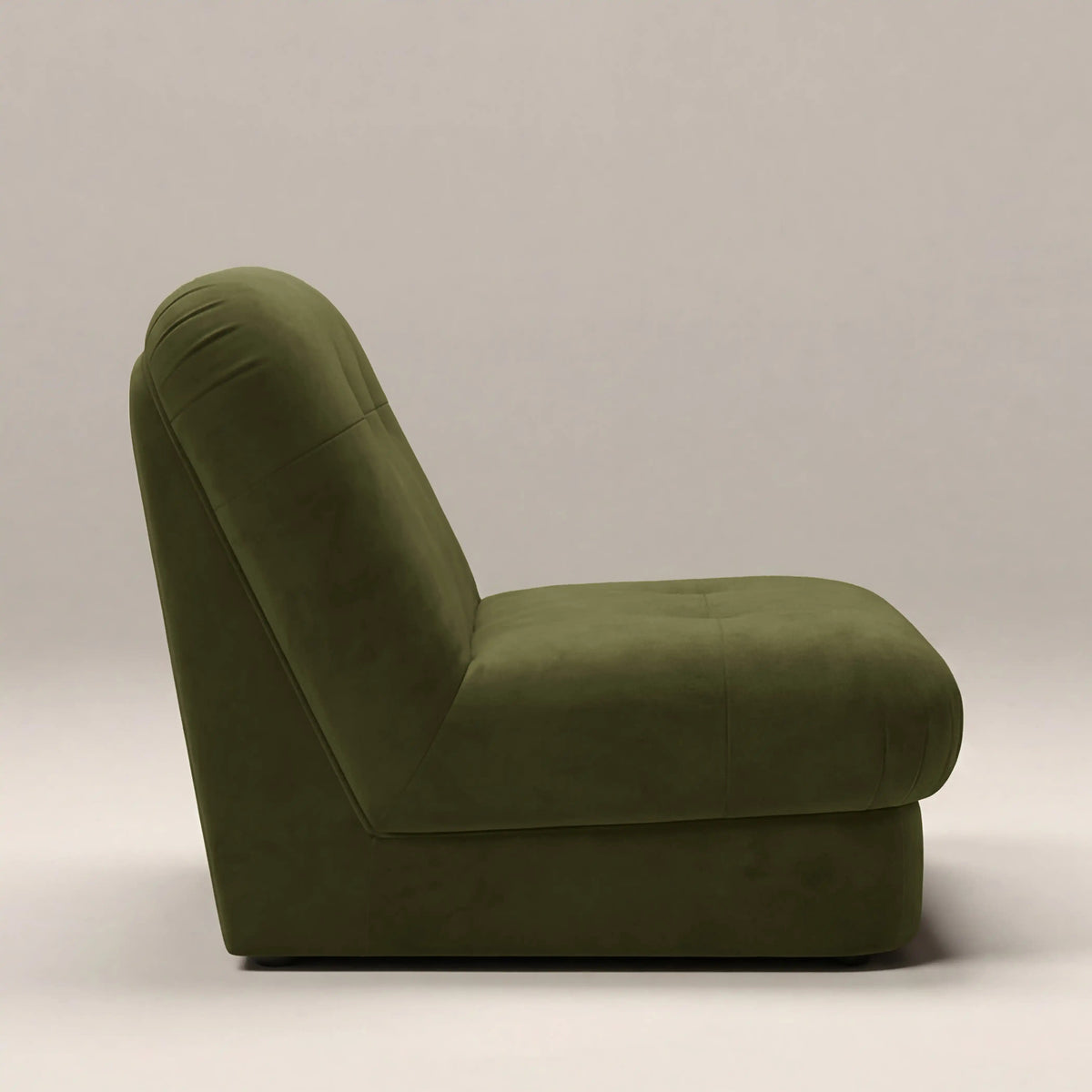 Freya Armchair in green fabric, angled view