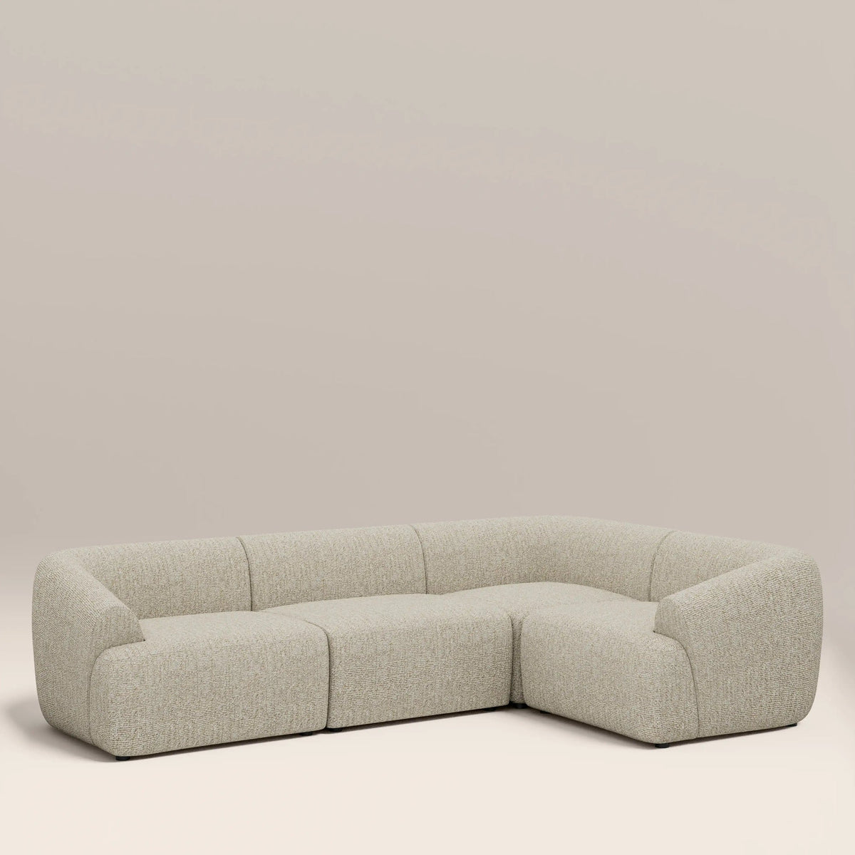 Cream corner sofa seen from the side, showing low back profile